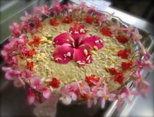 A bursting raw soup topped off by a Hibiscus centrepiece