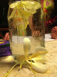 Jar of drinking water with edible flowers